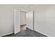 Bedroom with gray carpet and access to another room at 3047 Deerberry Place, Longs, SC 29568
