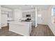 Eat-in kitchen with island, stainless steel appliances, and gray cabinets at 3047 Deerberry Place, Longs, SC 29568