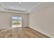 Bright room featuring vinyl plank flooring and sliding glass door at 3009 Deerberry Place, Longs, SC 29568