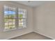 Bright bedroom with carpet flooring and two large windows at 3009 Deerberry Place, Longs, SC 29568