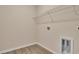 Laundry room with vinyl plank flooring and wire shelving at 3009 Deerberry Place, Longs, SC 29568