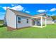 House exterior showcasing back porch and landscaping at 3009 Deerberry Place, Longs, SC 29568