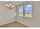 Bright dining room with hardwood floors and large windows at 3009 Deerberry Place, Longs, SC 29568