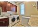 Laundry room with washer, dryer, and extra storage at 202 Palmetto Harbour Dr., North Myrtle Beach, NC 29582