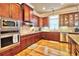 Modern kitchen with stainless steel appliances and ample wood cabinetry at 202 Palmetto Harbour Dr., North Myrtle Beach, NC 29582