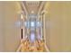 Long hallway with hardwood floors and multiple doors at 202 Palmetto Harbour Dr., North Myrtle Beach, NC 29582