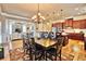 Open dining room with large table, hardwood floors and kitchen view at 202 Palmetto Harbour Dr., North Myrtle Beach, NC 29582