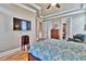 Spacious bedroom with hardwood floors and a large TV at 202 Palmetto Harbour Dr., North Myrtle Beach, NC 29582