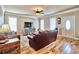 Bright living room featuring hardwood floors, large windows, and comfortable seating at 202 Palmetto Harbour Dr., North Myrtle Beach, NC 29582
