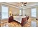 Comfortable bedroom featuring hardwood floors and large windows at 202 Palmetto Harbour Dr., North Myrtle Beach, NC 29582