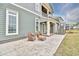 Private patio with wicker chairs and access to the house at 202 Palmetto Harbour Dr., North Myrtle Beach, NC 29582