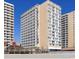 Exterior view of a beachfront high-rise building on a sunny day at 9550 Shore Dr. # 925, Myrtle Beach, SC 29572