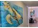 Hallway with coastal-themed artwork leading to the dining area at 9550 Shore Dr. # 925, Myrtle Beach, SC 29572