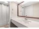 Clean bathroom with single sink vanity, shower, and mirror at 1501 S Ocean Blvd. # 938, Myrtle Beach, SC 29577