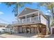 Elevated beach house with a large deck and parking underneath at 6001-1783 S Kings Hwy., Myrtle Beach, SC 29575