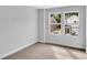 Bright bedroom featuring two large windows with backyard view at 301 Sandridgebury Dr. # 68, Little River, SC 29566