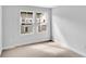 Well-lit bedroom with two large windows offering a view of the neighborhood at 301 Sandridgebury Dr. # 68, Little River, SC 29566