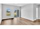 Bedroom with hardwood floors, sliding glass door, and two windows at 301 Sandridgebury Dr. # 68, Little River, SC 29566