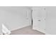 Well-lit bedroom featuring neutral walls, carpet flooring and a double door closet at 301 Sandridgebury Dr. # 68, Little River, SC 29566