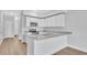 Modern kitchen with white cabinets and granite countertops at 301 Sandridgebury Dr. # 68, Little River, SC 29566