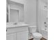 Clean bathroom with white vanity, toilet, and bathtub/shower combo at 301 Sandridgebury Dr. # 68, Little River, SC 29566