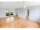 Living room with light gray walls, wood parquet flooring, and large windows at 660 Cardinal Ave. # 660, Myrtle Beach, SC 29577