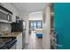 View of condo interior with kitchen and bedroom at 2207 S Ocean Blvd. # 701, Myrtle Beach, SC 29577