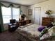 Main bedroom with a desk, dresser, and large bed at 12727 Ocean Highway, Pawleys Island, SC 29585