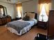 Main bedroom with zebra patterned bedding and wood furniture at 12727 Ocean Highway, Pawleys Island, SC 29585