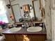 Double vanity bathroom with large mirror at 12727 Ocean Highway, Pawleys Island, SC 29585