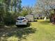 Spacious backyard with storage shed and vehicle at 12727 Ocean Highway, Pawleys Island, SC 29585