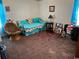 Bedroom with daybed, armchair, and plush carpeting at 12727 Ocean Highway, Pawleys Island, SC 29585