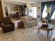 Spacious living room with floral couch and seating area at 12727 Ocean Highway, Pawleys Island, SC 29585