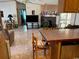 Spacious living room with stone fireplace and kitchen at 12727 Ocean Highway, Pawleys Island, SC 29585