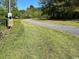Gravel driveway leading to a wooded area at 12727 Ocean Highway, Pawleys Island, SC 29585