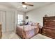 Bright bedroom with a double bed, dresser, and rocking chair at 400 Foxtail Dr., Longs, SC 29568