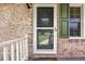 Front door with screen door and green shutters at 129 Meadowview Rd., Marion, SC 29571
