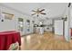 Kitchen with white cabinets, breakfast bar, and access to backyard at 129 Meadowview Rd., Marion, SC 29571