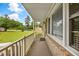 Covered porch with brick exterior and white railings at 129 Meadowview Rd., Marion, SC 29571