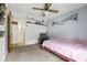 Charming bedroom with a pink bedspread and built-in shelving at 129 Meadowview Rd., Marion, SC 29571