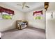 Bright bedroom with carpet, ceiling fan, and two windows at 129 Meadowview Rd., Marion, SC 29571