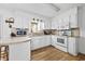 Updated kitchen with white cabinets and a view of the backyard at 129 Meadowview Rd., Marion, SC 29571