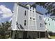 Three-story house, light blue siding, dark garage at 104 Tidal Creek Dr., Murrells Inlet, SC 29576