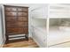 Bunk beds and wooden dresser in a bright bedroom at 104 Tidal Creek Dr., Murrells Inlet, SC 29576