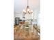 Bright kitchen with white cabinets, farmhouse table, stainless steel appliances at 104 Tidal Creek Dr., Murrells Inlet, SC 29576