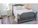 Cozy bedroom with a comfortable queen-size bed and hardwood floors at 116 Tidal Creek Dr., Murrells Inlet, SC 29576