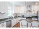 Modern kitchen with white shaker cabinets, granite countertops, and stainless steel appliances at 116 Tidal Creek Dr., Murrells Inlet, SC 29576