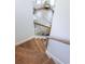 Wooden staircase with black metal railing leading to the upper level at 116 Tidal Creek Dr., Murrells Inlet, SC 29576