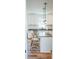 Bright kitchen with white cabinets, granite island, and pendant lighting at 116 Tidal Creek Dr., Murrells Inlet, SC 29576