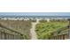 A pathway through dunes leads to a beautiful beach at 2207 S Ocean Blvd. # 1521, Myrtle Beach, SC 29577